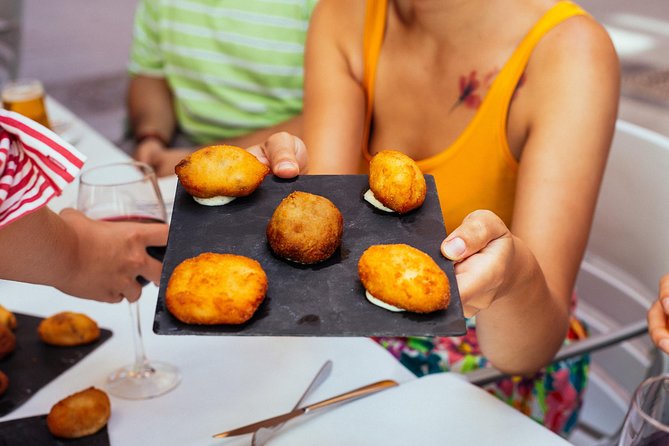 The 10 Tastings of Valencia With Locals: Private Food Walking Tour - Stop 2: La Lonja de la Seda and Valencia Classics You Can Recognize