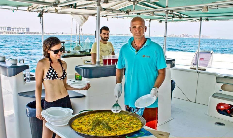Valencia: Sailing Catamaran Cruise with Valencian Lunch - The swim stop: sunbathing and anchoring away from crowded beaches